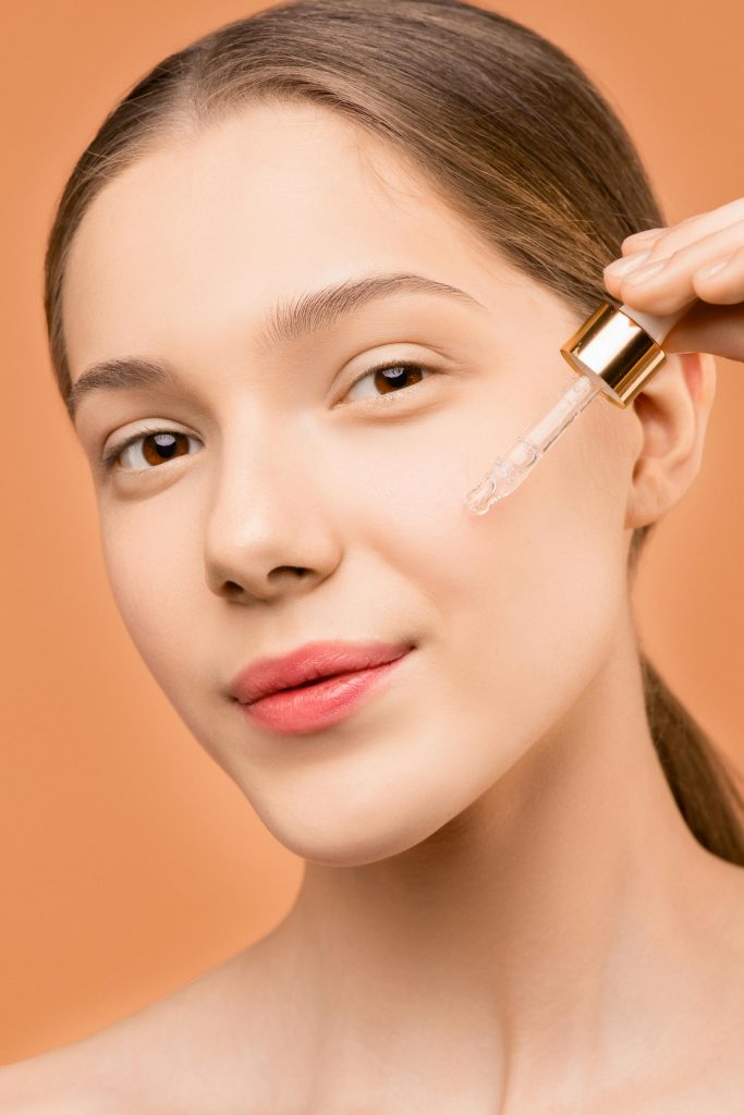lady with dropper on face